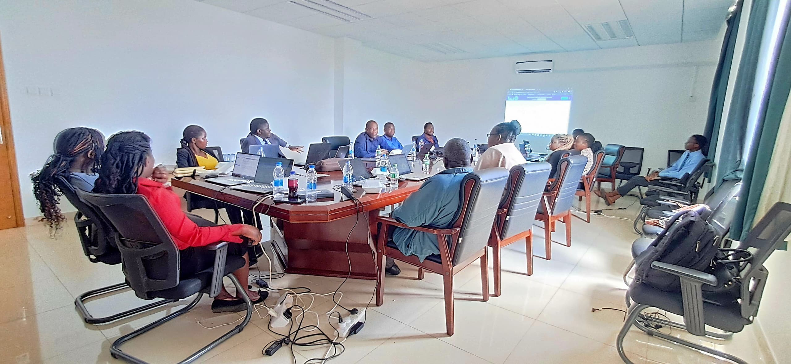 Participants gathered around a large meeting table.